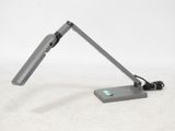 a desk lamp that is sitting on a table