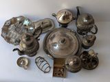 a lot of silver items on a white table