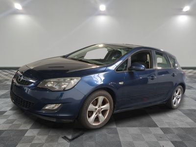 a picture of a blue car parked in a garage
