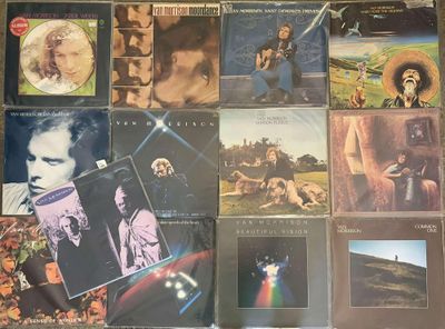 the album covers of various albums are displayed on a table
