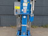 a blue machine that is sitting on the ground
