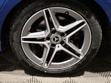a close up of a wheel on a blue car