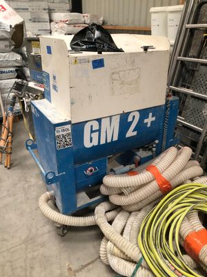 a large box of hoses sitting on top of a cart in a warehouse