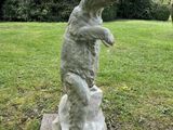 a statue of a bear that is standing on its hind legs
