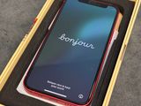 an iphone xr in a box on a table with the box open