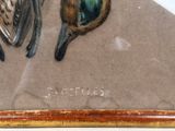 two birds that are sitting on a piece of paper