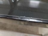 a close up of a metal table with a glass top
