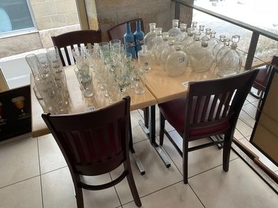 a table with a lot of empty wine glasses on it