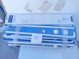 a stack of blue and white pipes sitting on top of a box