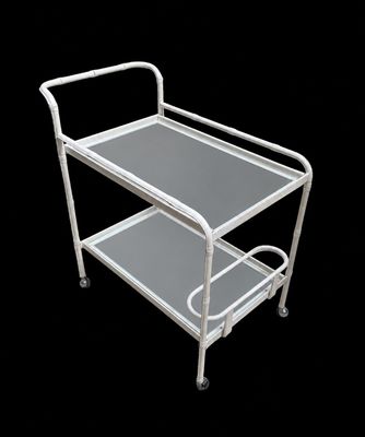 a white metal trolley with two shelves on it