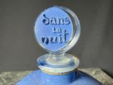 a blue bottle that has some writing on it