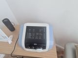 a small table with a monitor on it in a room