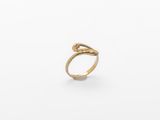 a gold ring with a snake ' s head on it