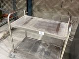 a metal cart that is sitting on the ground