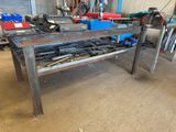 a workbench with tools on it in a garage