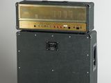 two amps are stacked on top of each other on a white surface