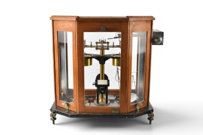 a clock that is sitting inside of a glass case