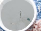 a close up of a coffee cup with a small stick sticking out of it