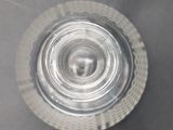 overhead view of a glass of water on a gray surface