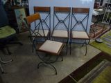 four chairs are sitting next to each other in a room