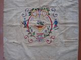an old embroidered bag with a picture of a teapot on it
