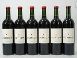 six bottles of red wine are lined up in a row