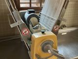 a machine that is sitting in a kitchen next to a window