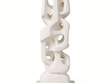 a white sculpture that is sitting on top of a table