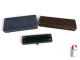 three pieces of leather are sitting next to each other