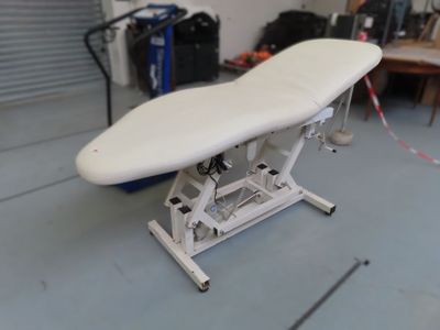 a white ironing board sitting on top of a table