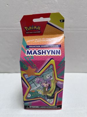 un gros plan sur une boîte de cartes à collectionner Pokémon posée sur une table
