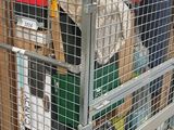 a metal cart with many items in it in a store