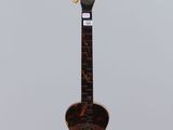 a guitar hanging from a string in the air