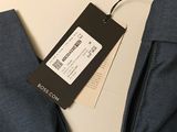 the back of a pair of blue jeans with a tag on it