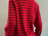 a red and black striped sweater on a mannequin mannequin mannequin mannequin mannequin mannequin mannequin mannequin