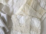 a lot of white clothing on a table