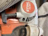 a small machine with a hose attached to it