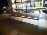 a room with shelves and a table in it
