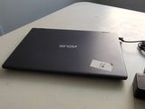 a laptop computer sitting on a table with a mouse next to it