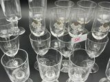a lot of empty wine glasses on the table