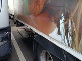 a truck with a picture of a woman on the side of it