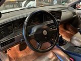 a dashboard and steering wheel of a car in a car showroom