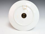 a white plate with a gold trim on it