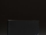 a black leather wallet with a logo on the front