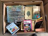 a box full of books that are sitting on the floor
