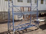 a picture of a blue scaffolding in front of a building