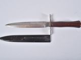 two knives that are sitting on a white surface