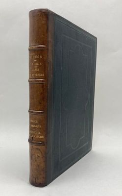 an old book sitting on top of a table next to a white background