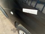 a sticker on the side of a black car