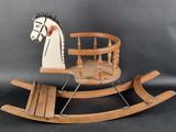 a wooden rocking horse that is sitting on a table